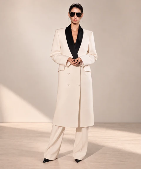 Ivory longline jacket with black shawl collar and matching trousers