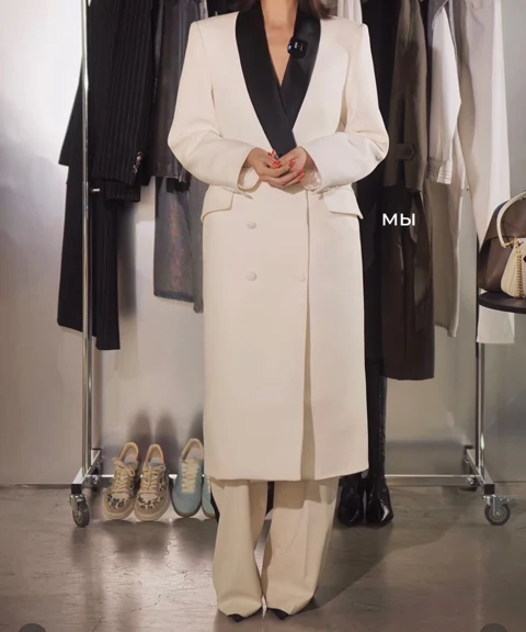 Ivory longline jacket with black shawl collar and matching trousers